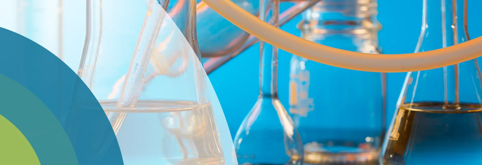 Laboratory glass flasks connected by tubing, from the original HMC website